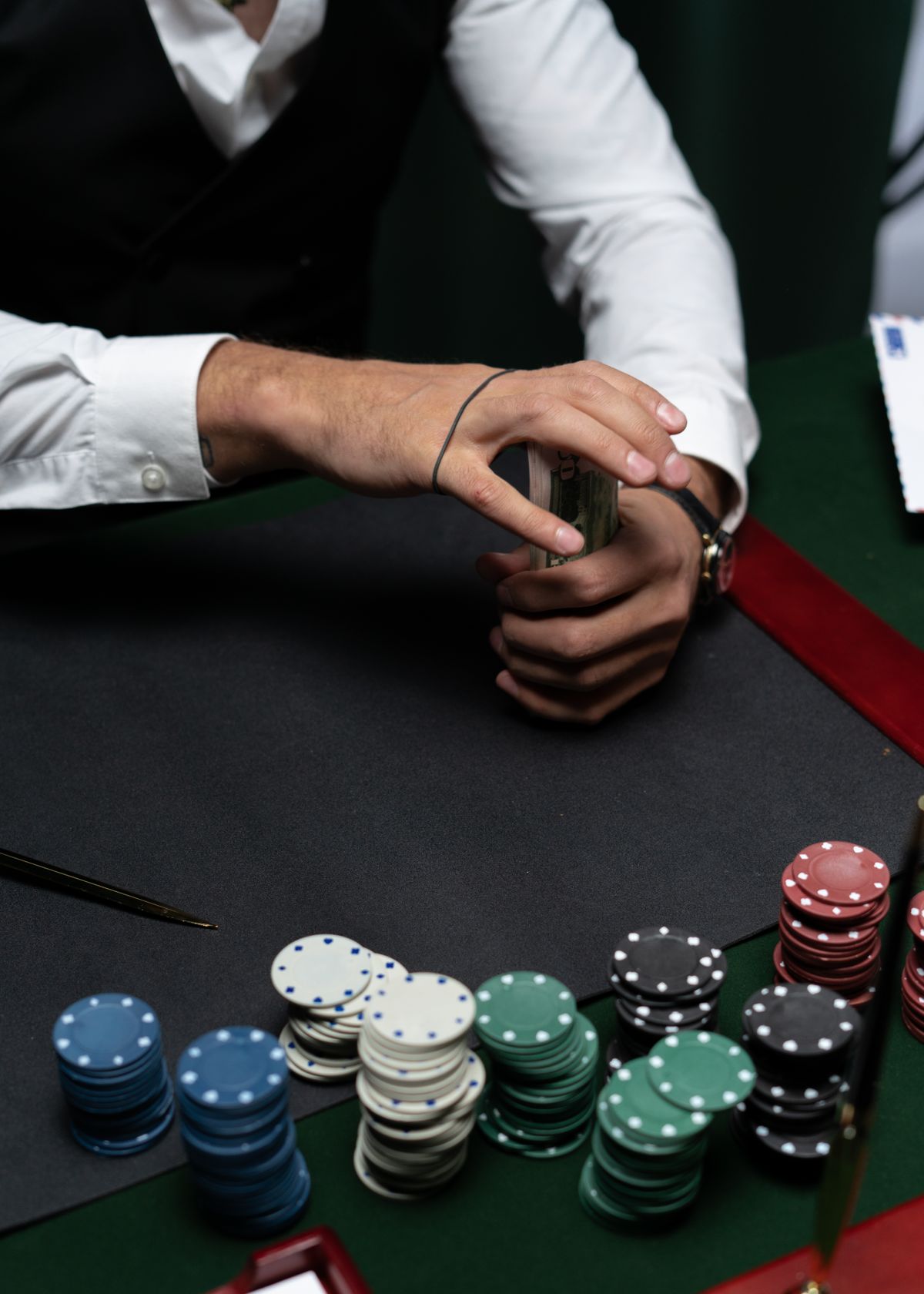 Casino chips and money on a gaming table representing financial losses